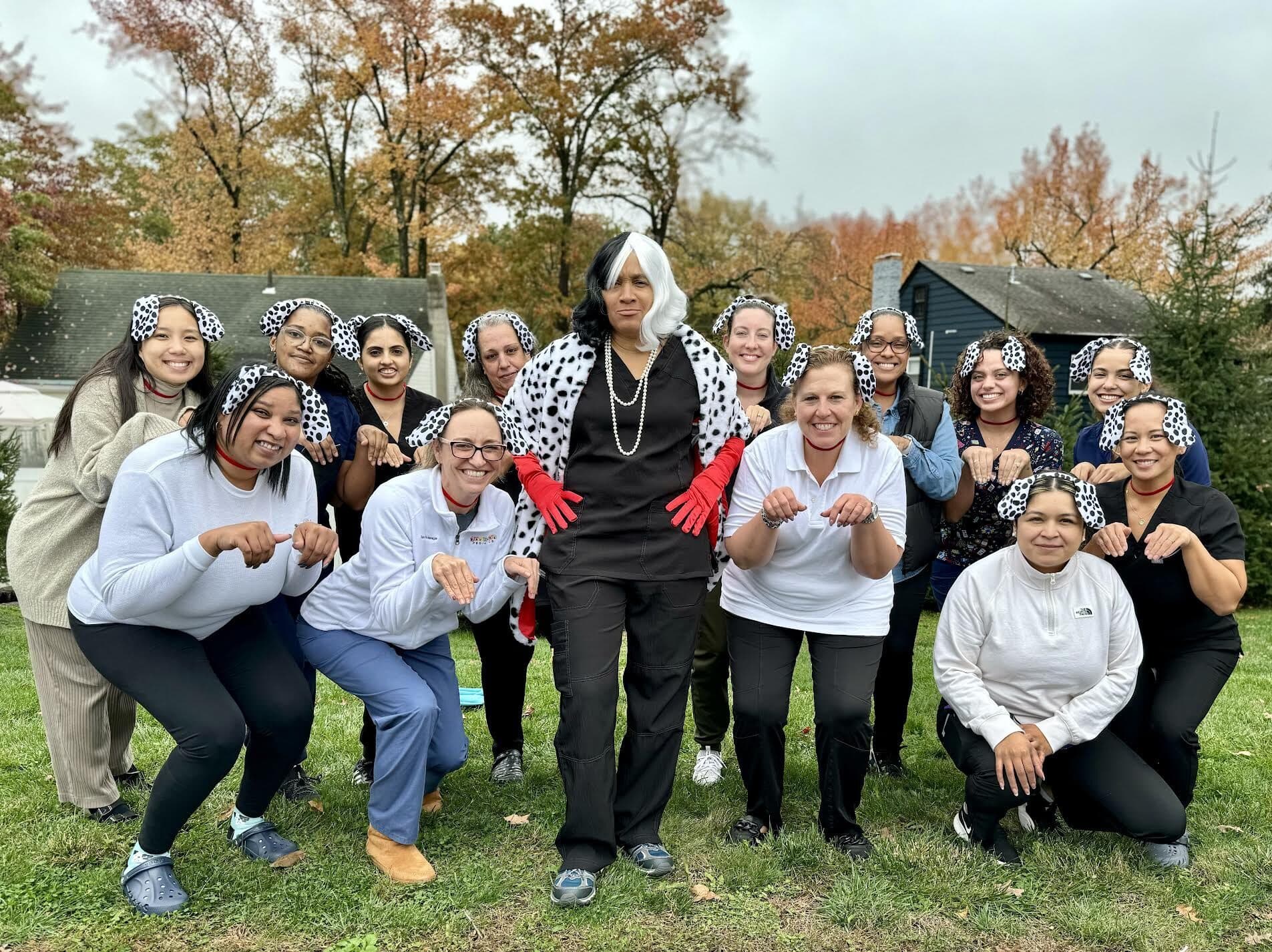 Fanwood office staff in dalmatian costumes for Halloween